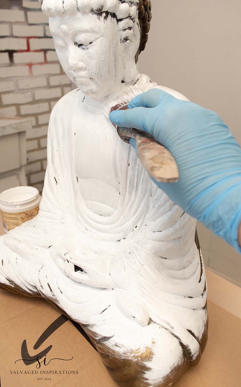 Painting Buddha Statue In White Paint