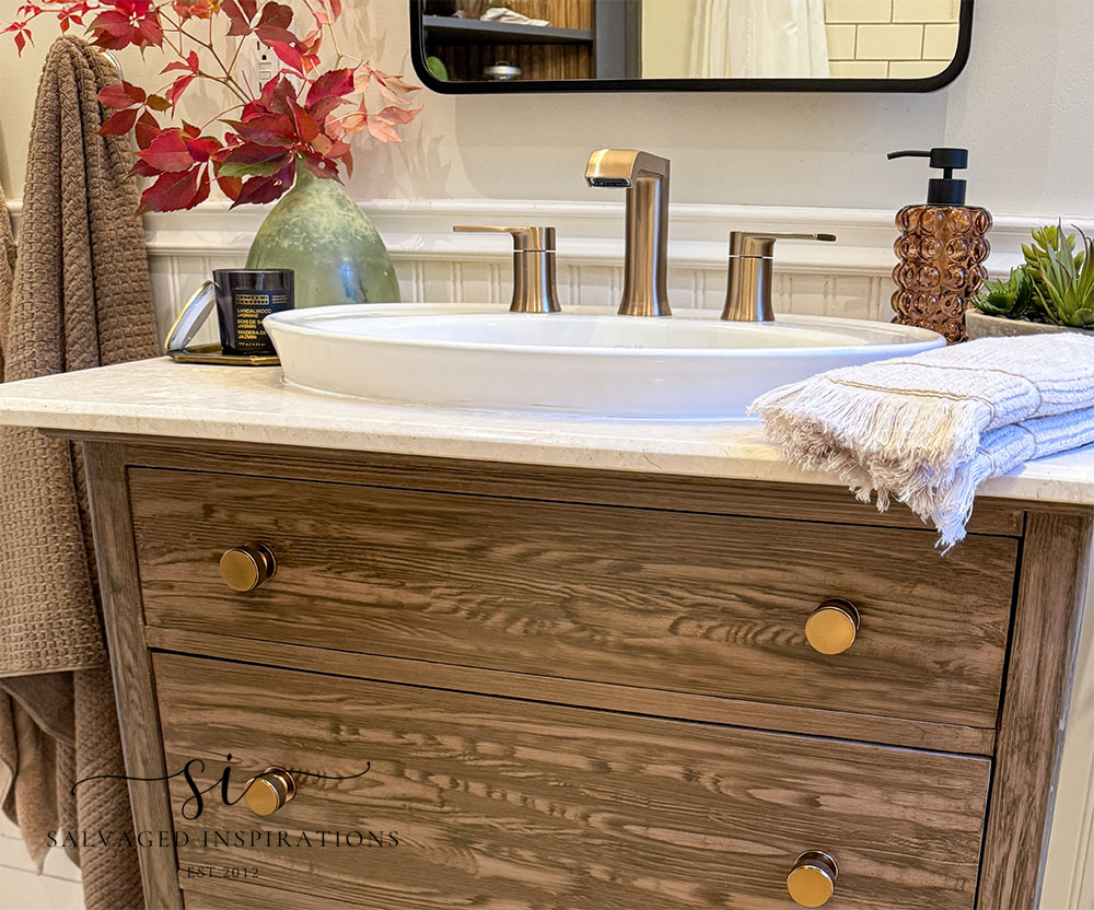 Close up of faux painted vanity to look like wood